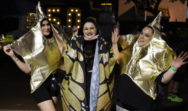 3 people dressed up in gold star and butterfly costumes