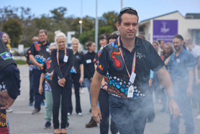 man walking through smoke