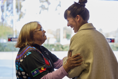 Two women smiling together