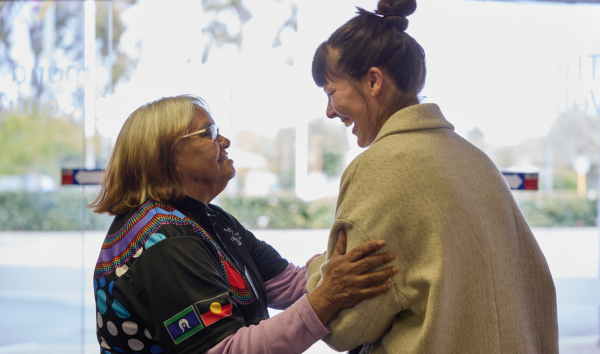 Two women smiling together