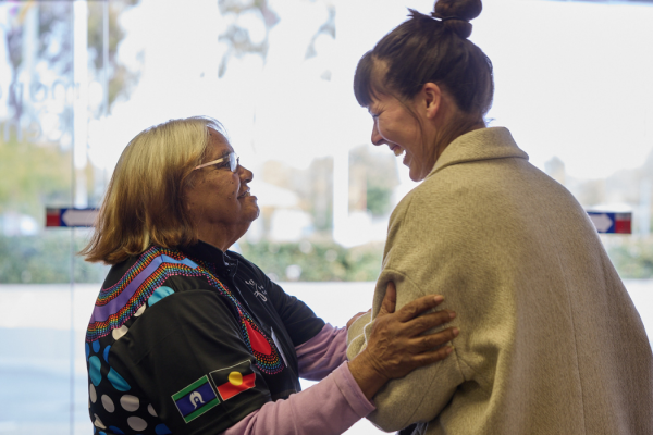 Two women smiling together