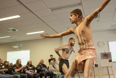 men dancing traditional Aboriginal dance in traditional clothing