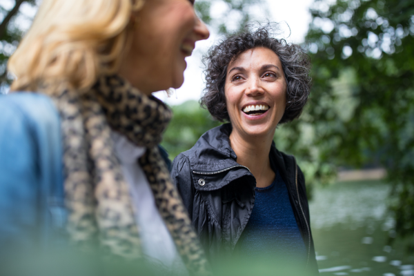 two women outside walking together