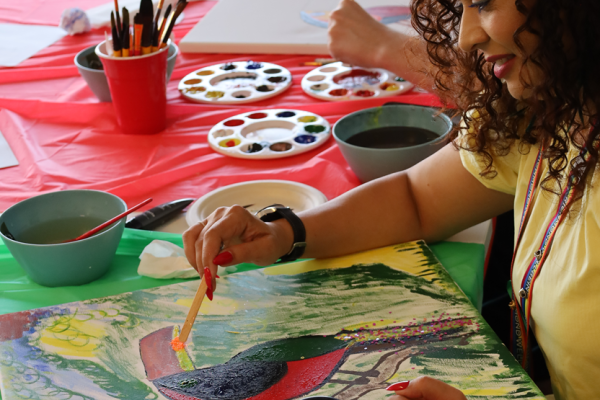 Woman painting on canvas